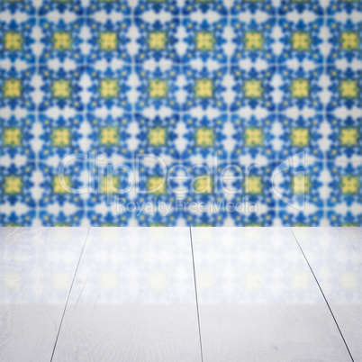 Wood table top and blur vintage ceramic tile pattern wall