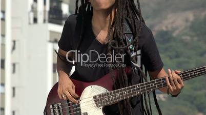 African Reggea Guitarist With Dreadlocks Jumping