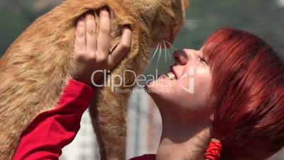 Redheaded Teen Playing With Cat