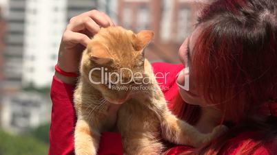 Redheaded Young Woman and Cat