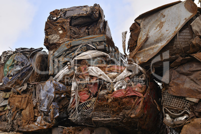 A pile of compressed cars in blocks for processing