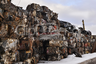 A pile of compressed cars in blocks for processing