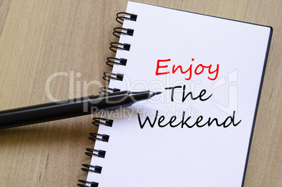 Enjoy the weekend write on notebook