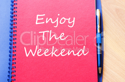 Enjoy the weekend write on notebook