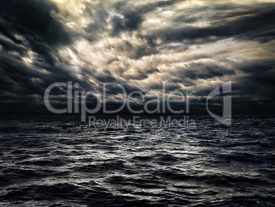 dark stormy sea with a dramatic cloudy sky