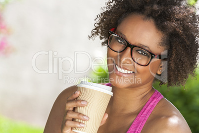 African American Woman In Glasses Drinking Coffee