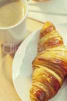 Continental Breakfast Croissant and Cup Of Coffee
