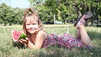 little girl eat watermelon