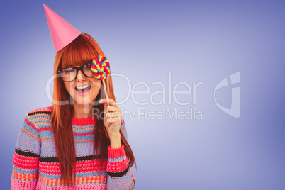 Composite image of smiling hipster woman with lollipop and hat p