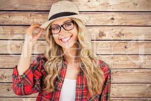 Composite image of gorgeous smiling blonde hipster posing