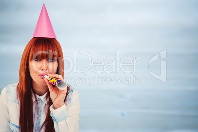 Composite image of smiling hipster woman wearing hat party