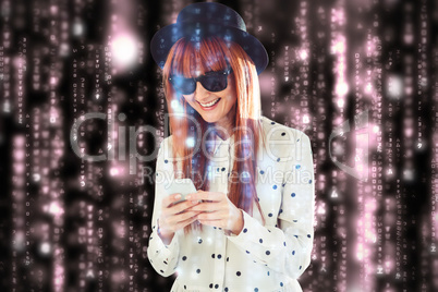 Composite image of smiling hipster woman texting with her smartp