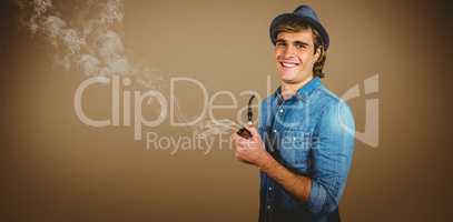 Composite image of cheerful hipster holding pipe