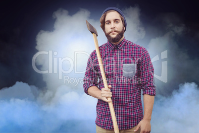 Composite image of portrait of hipster holding axe