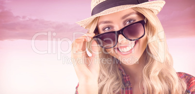 Composite image of gorgeous smiling blonde hipster posing with s