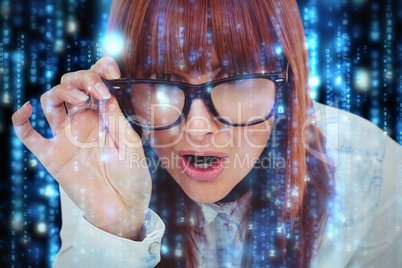Composite image of smiling hipster woman holding her glasses