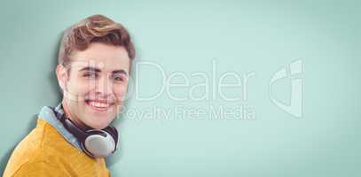 Composite image of happy man with headphones