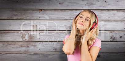 Composite image of pretty young woman with headphones