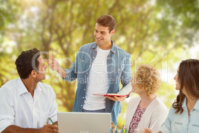 Composite image of group of young colleagues in a meeting