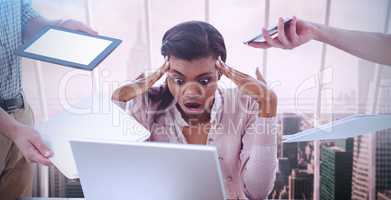 Composite image of businesswoman stressed out at work