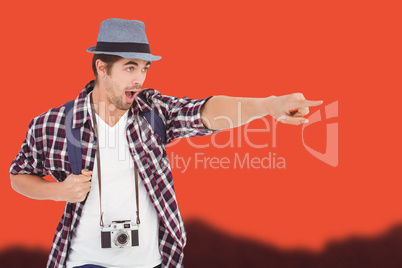 Composite image of surprised man with backpack pointing