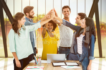 Composite image of group of young colleagues using laptop