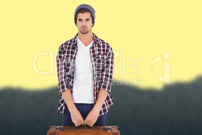 Composite image of portrait of confident man holding bag