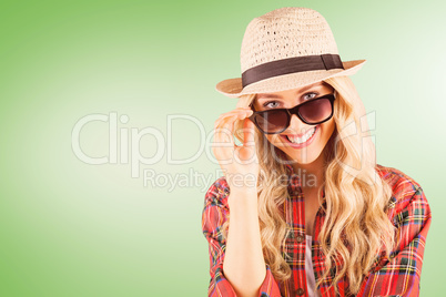 Composite image of gorgeous smiling blonde hipster posing with s