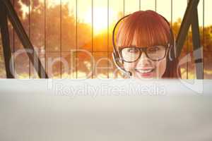 Composite image of attractive hipster woman with headset
