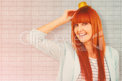 Composite image of smiling hipster woman wearing hat party