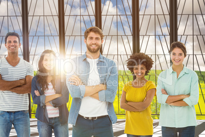 Composite image of group portrait of happy young colleagues