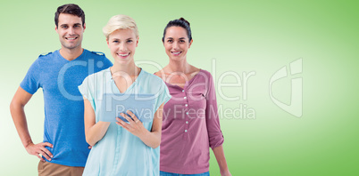 Composite image of group of three persons using tablet