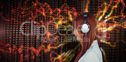 Composite image of happy man with headphones