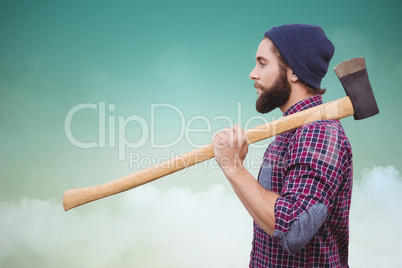 Composite image of side view of hipster with axe on shoulder