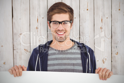 Composite image of portrait of man wearing eye glasses holding b