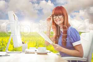 Composite image of smiling hipster woman with document