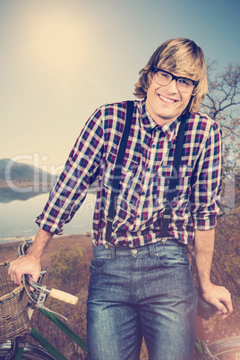 Composite image of portrait of smiling blond hipster