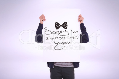 Man holding small blackboard