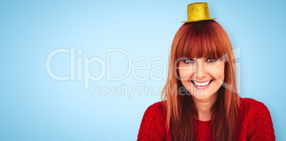 Composite image of smiling hipster woman with party hat