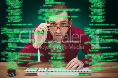 Composite image of surprised creative businessman working at des