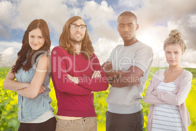 Composite image of portrait of business team with arms crossed