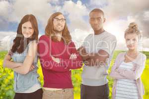 Composite image of portrait of business team with arms crossed