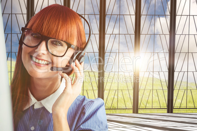 Composite image of attractive hipster woman with headset