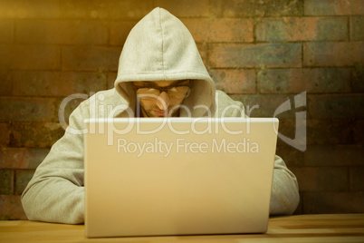 Composite image of creative businessman with hooded shirt workin