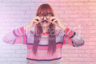 Composite image of smiling hipster woman with a mustache