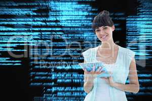 Composite image of happy woman using tablet