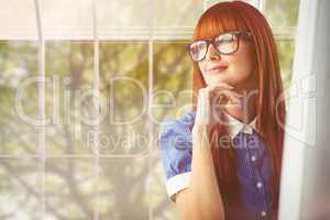 Composite image of attractive smiling hipster woman thinking