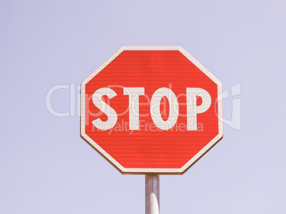 Stop sign over blue sky vintage