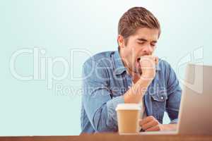 Composite image of tired businessman sitting at desk