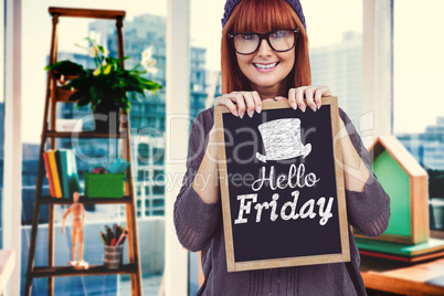 Composite image of smiling hipster woman holding blackboard